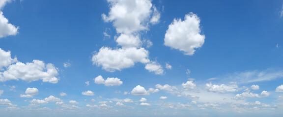 Naklejka na ściany i meble Panorama of blue sky with white clouds . 