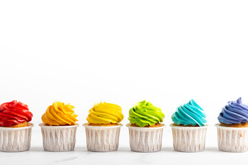 Colorful cupcakes on the white background