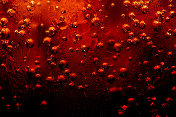 Close up view of the ice cubes in cola background ,Detail of Cold Bubbly Carbonated Soft Drink with Ice 