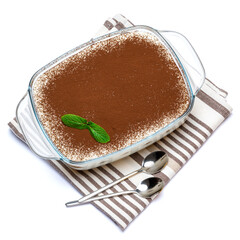 Traditional Italian Tiramisu dessert in glass baking dish isolated on white background with clipping path