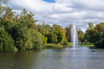View of the pond with a water fountain in the spa gardens of Wiesbaden / Germany, the state capital of Hesse