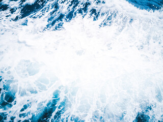 White bubble of wave caused by the boat running through the ocean.