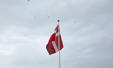 danish flad with rain clouds in the background