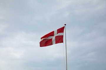 danish flad with rain clouds in the background