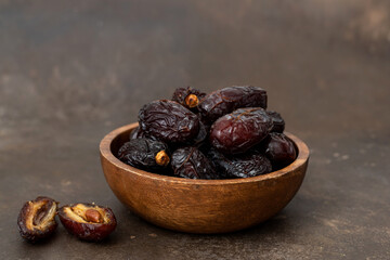 Fresh medjool dates in bowl.