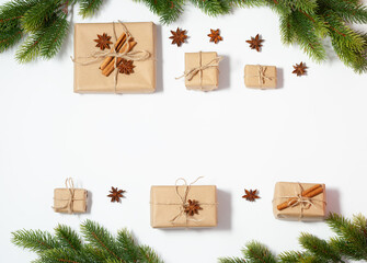 Christmas flat lay frame with copy space mockup. Present boxes and fir tree branches composition