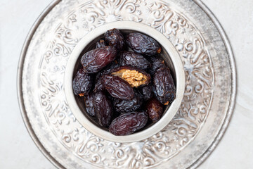 Juicy organic Medjool dates  on  background