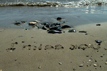 Fototapeta na wymiar Sea beach with words I Miss You written on wet sand