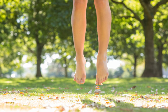 Close Up Of Female Feet Jumping High In The Air