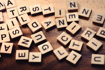 Blurred Text dice cube background. abstract blur. Text dice cube concept / Letter dices alphabet on wooden background. Block of alphabet studded on the floor. vintage style.