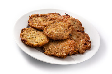 Traditional Jewish latkes or potato pancakes isolated on white background