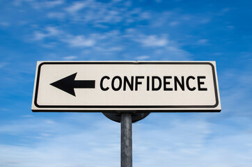 Confidence road sign, arrow on blue sky background. One way blank road sign with copy space. Arrow on a pole pointing in one direction.