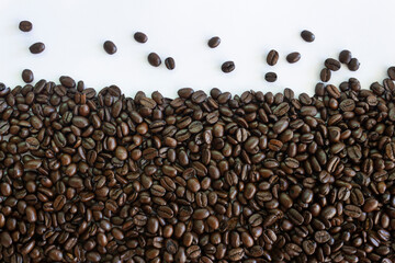 Roasted coffee beans on white background.Creative background concept.