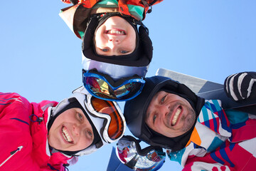 Skiing, winter fun - skiers enjoying ski holidays