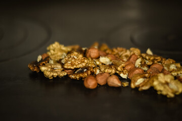 Assorted nuts on old kitchen. walnuts, hazelnuts, cashews, ...
