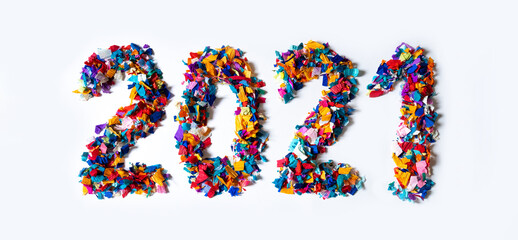 Colorful 2021 date figures confetti bright blue pink orange yellow white background