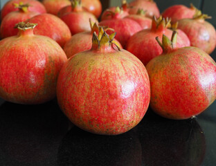 Fototapeta na wymiar Fresh ripe pomegranate on the table