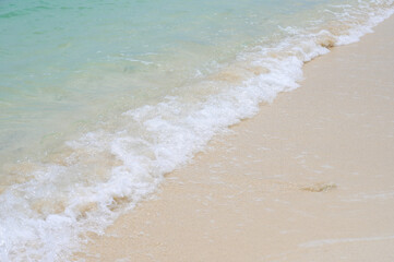 Sandy beach with ocean wave