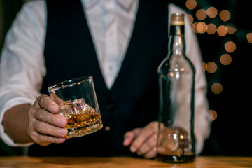 Barman pouring whiskey whiskey glass beautiful night