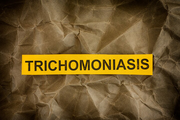 Yellow piece of paper with the word Trichomoniasis