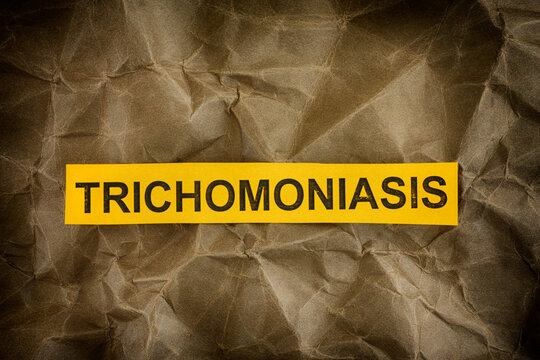 Yellow piece of paper with the word Trichomoniasis