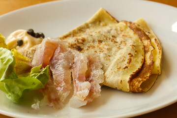 Gravlax with pancake served salad
