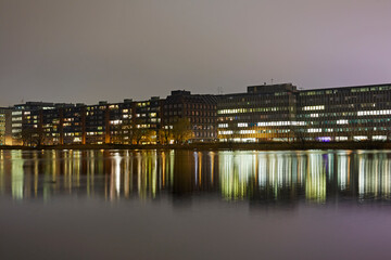 Modern architecture along the Kalvebod Brygge waterfront illuminated at night