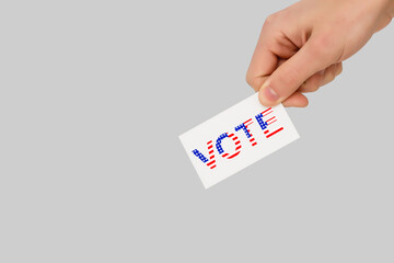 Ballot box with person casting vote on blank voting slip