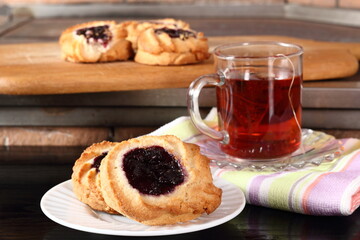 Marzipan cookies with jam and cup of tea
