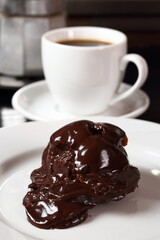 Choux with chocolate ganache and coffee cup