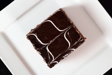 Layer cake with fruit and cream fillings decorated chocolate icing