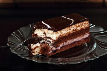 Layer cake with fruit and cream fillings decorated chocolate icing