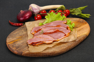 Sliced smoked duck breast served salad