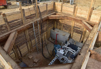 Tunnel boring machine in storm sewer collector for tunneling, auger boring, rock drilling. Jacking and Drilling ground for underground construction of sewers, pipe, drainage systems