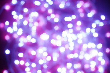 Blue lights on a purple background are blurred. Concept of blank frame,copy space. Christmas or new year flatlay background.