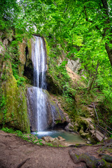 Fototapeta na wymiar Mountain waterfall Ripaljka in the forest park Ozren