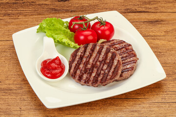Grilled burger cutlet with sauce