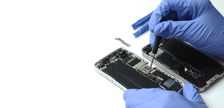 Technician repairing the Cell phone parts and tools for recovery repair phone smartphone and upgrade mobile technology, the concept of computer hardware inside.