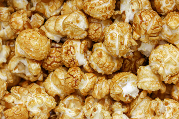 Popcorn Pattern. A pile of popcorn. Sweets. Popcorn Pattern. Caramel popcorn textured background. Food, cinema, movie. Top view. 