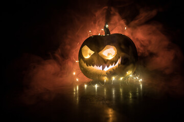 Halloween pumpkin smile and scary eyes for party night. Close up view of scary Halloween pumpkin...