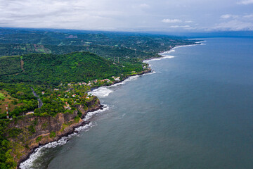 Fototapeta na wymiar Aerial view of sea waves and fantastic Rocky coast, El Salvador