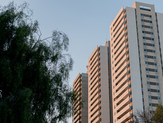 different photos of a group of gray buildings on a clear day