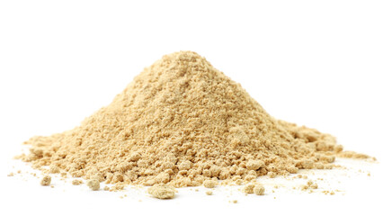 A pile of ground ginger on a white background. Isolated