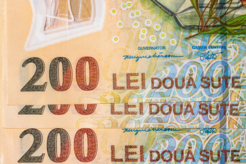 Selective focus on detail of lei banknotes. Close up macro detail of romanian lei banknotes, 200 lei isolated. World money concept, inflation and economy concept