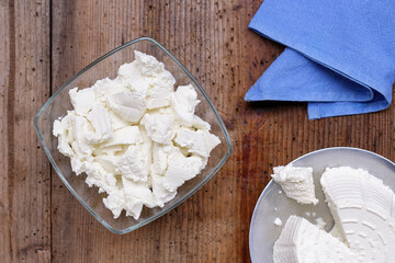 Ricotta cheese on wood background
