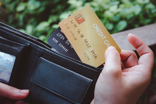 Woman hand open wallet showing credit card