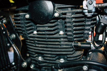 Fototapeta premium Closeup of a motorcycle parked in the streets of the city center of the metropolitan area 