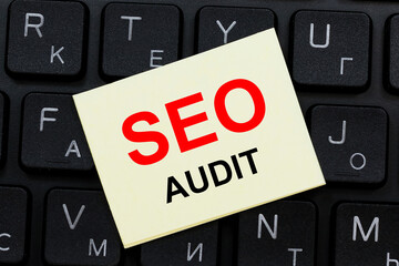 SEO AUDIT word concept on sticker on the keyboard