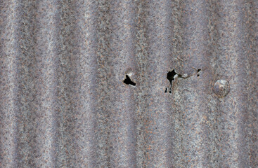 The surface of a rusty old metal object.