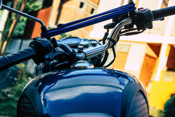 Closeup of a motorcycle parked in the streets of the city center of the metropolitan area
